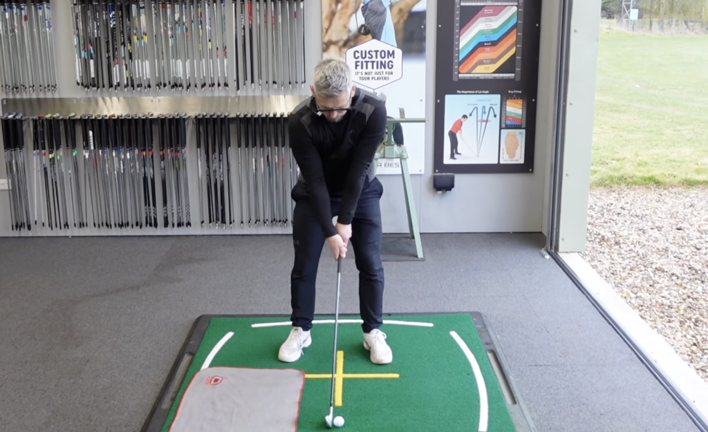 a towel drill to help understand the low point in the golf swing