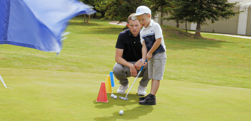a look at a child demonstrating the us kids height apppropriate putter