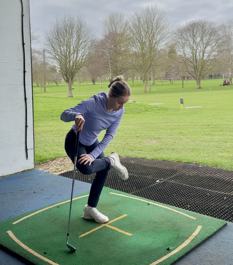 Golfer performing figure 4 stretches before golf.
