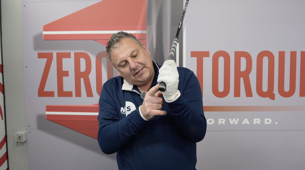 a close up view of Mark Sturgess golf coach, demonstrating where to hold the golf club.