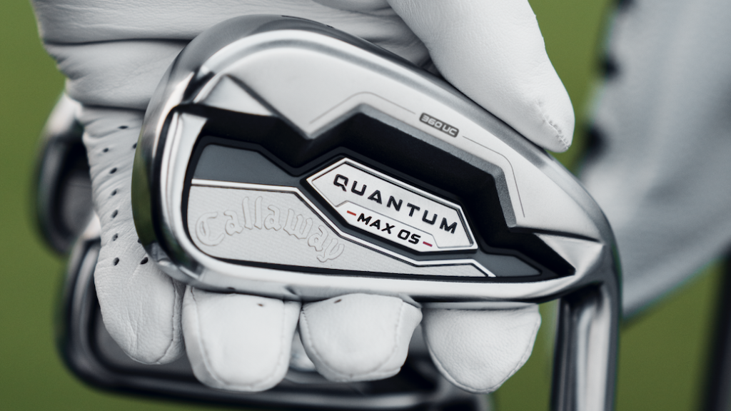 Golfer holding Callaway Quantum Max OS Irons in hand